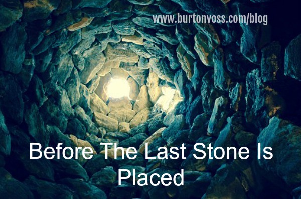 Looking up from the bottom of a stone-lined well.