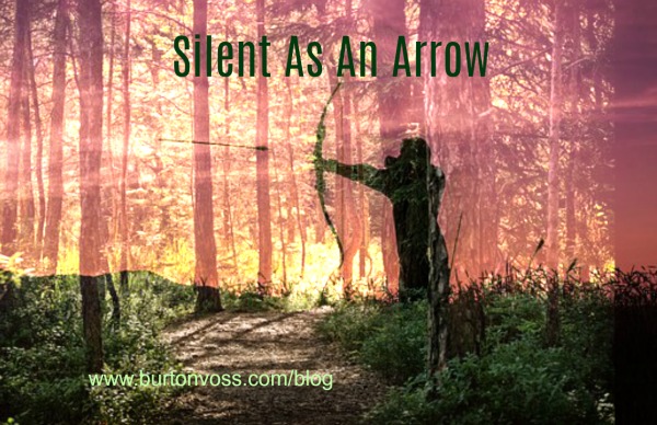 Silhouette of an Indian firing an arrow imposed over a picture of the forest.