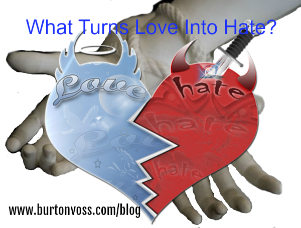 A two-tone heart, blue love and red hate overlays tied hands.