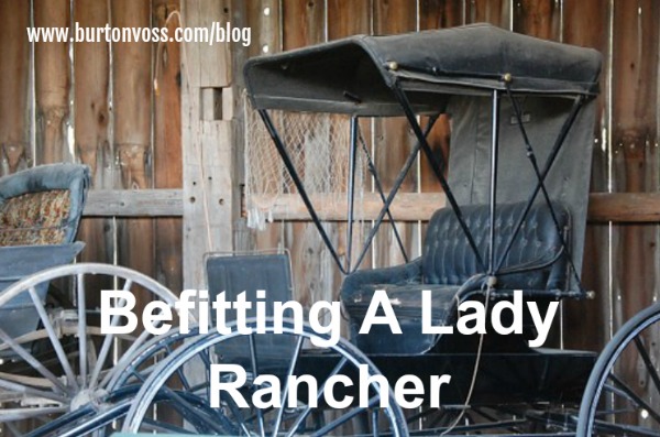 An old buggy sitting in a barn. It has rubber rims.